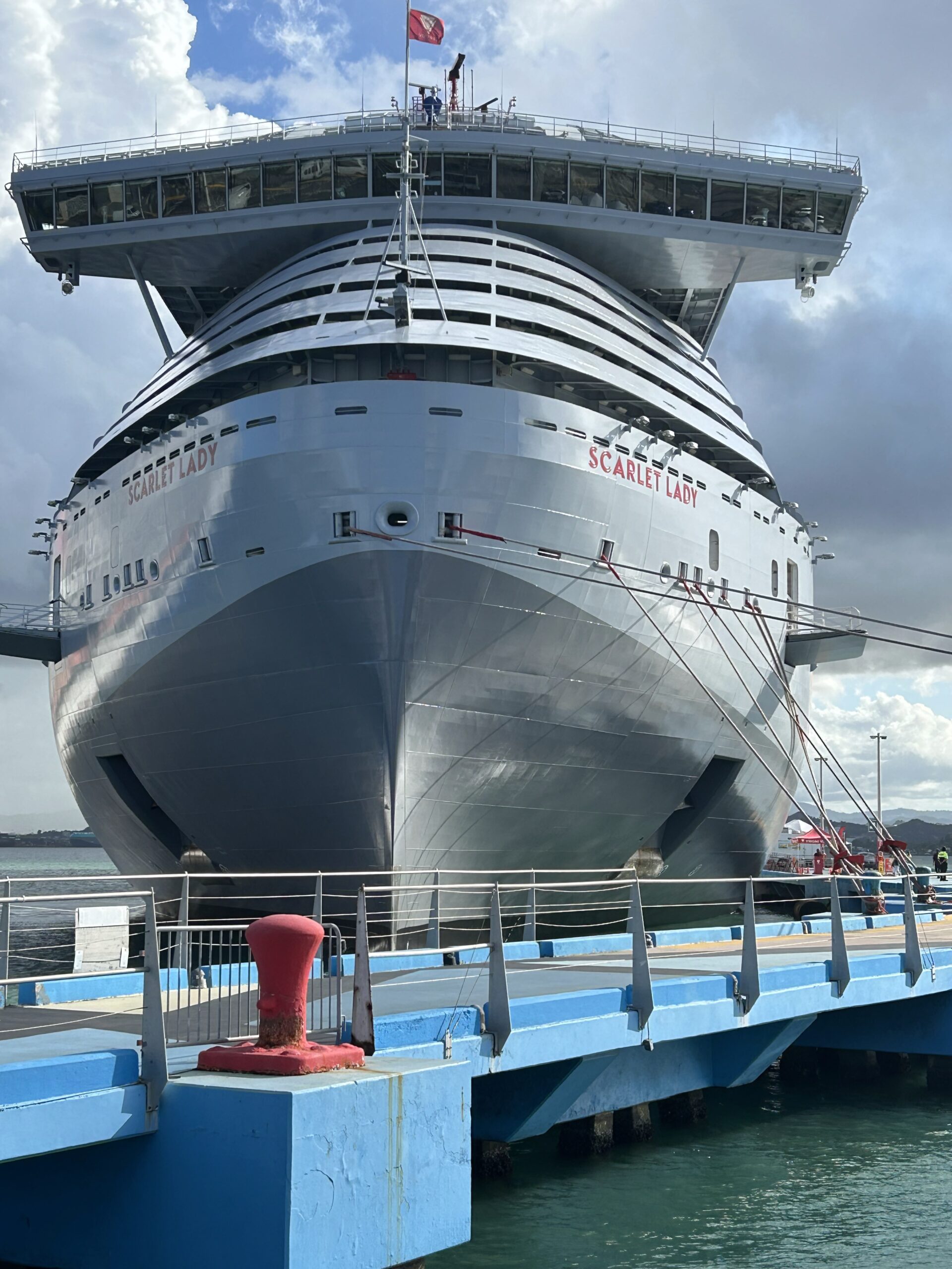 "Luxury cruise ship sailing through crystal-clear Caribbean waters, offering exclusive voyages designed by The Destination Specialists."